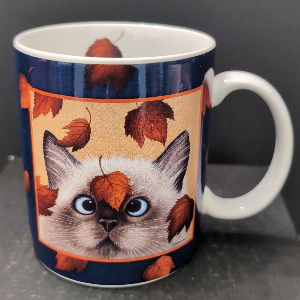 Lang And Wise,Erin Martin By Lowell Herrero 1996 Blue/White Catching Leaves Mug.
